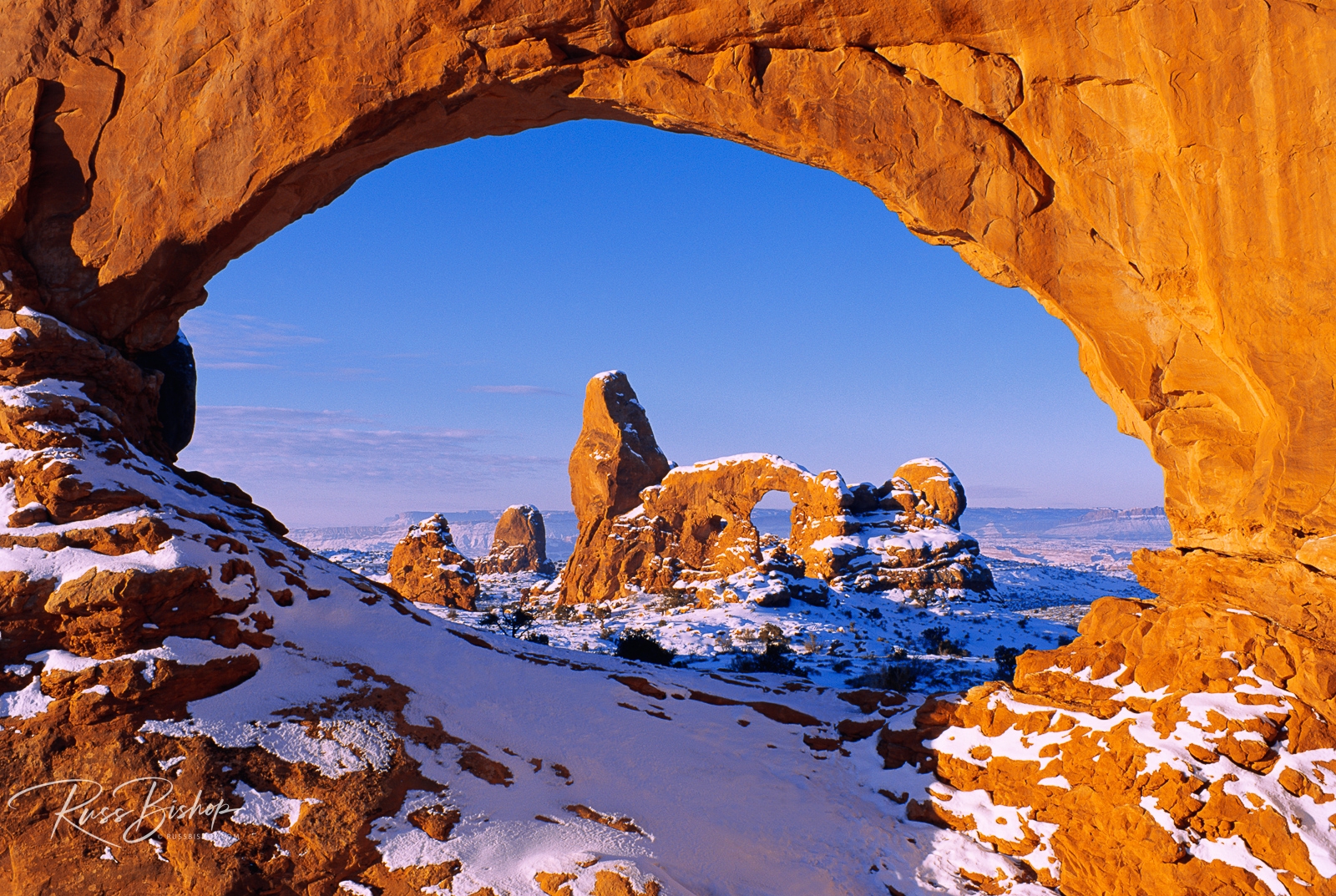 Cold Snap - Tips for Successful Winter Photography. North Window framing Turret Arch in winter, Arches National Park, Utah